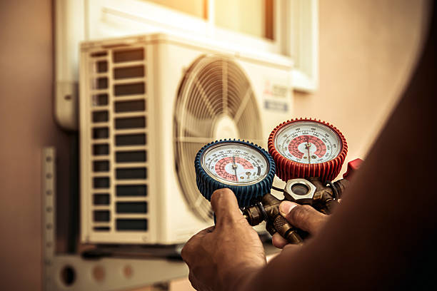 Professional Air Conditioning Service technician working in Perryopolis, PA